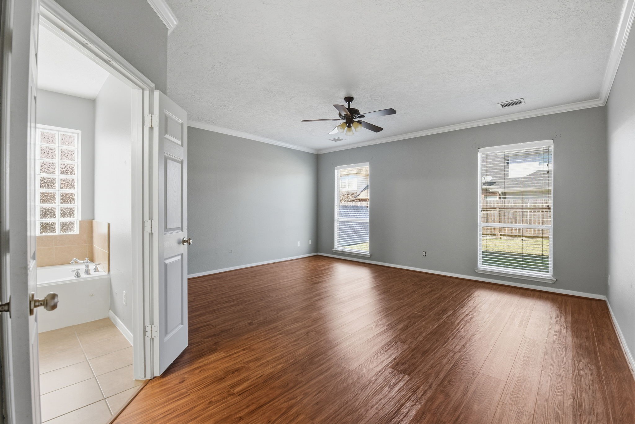 13902 Oneida Court Cypress, TX 77429 - Photo 23 of 48 wooden floor in an empty room with a window