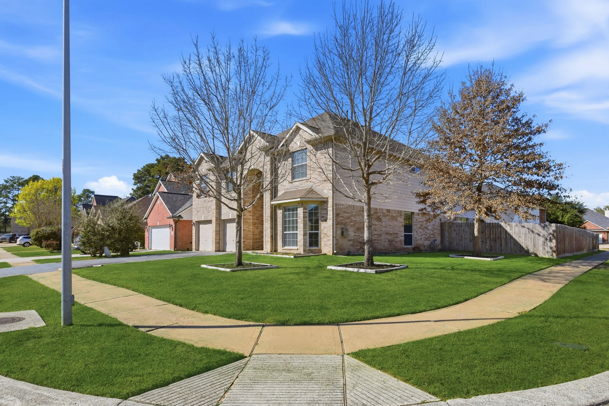 13902 Oneida Court Cypress, TX 77429 - Photo 3 of 48 a front view of a house with a yard