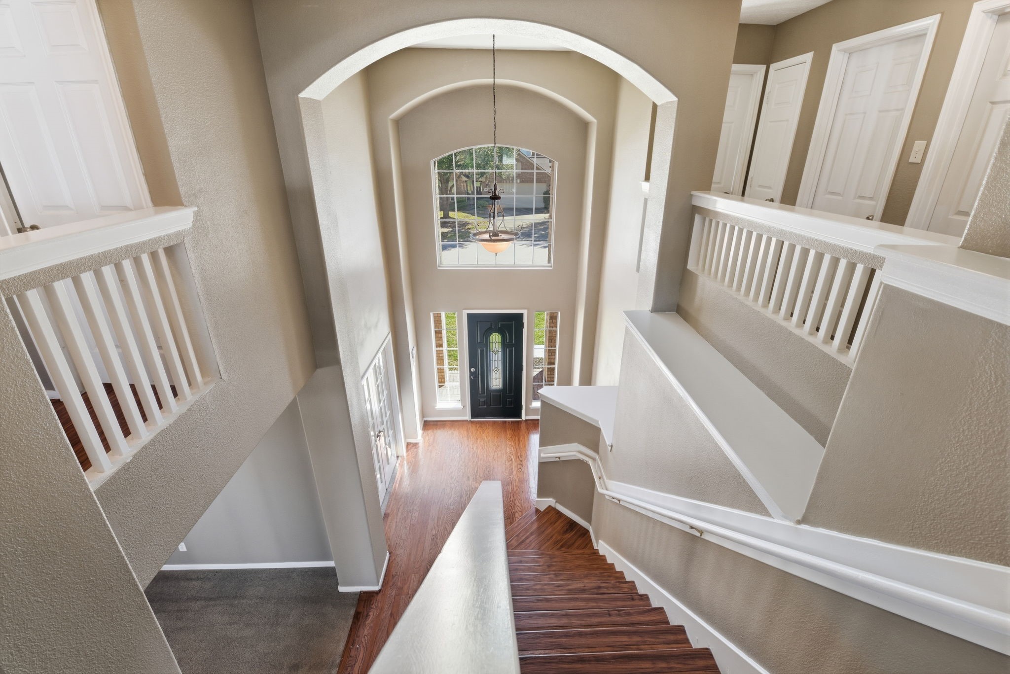 13902 Oneida Court Cypress, TX 77429 - Photo 32 of 48 a view of staircase with wooden floor and a front door