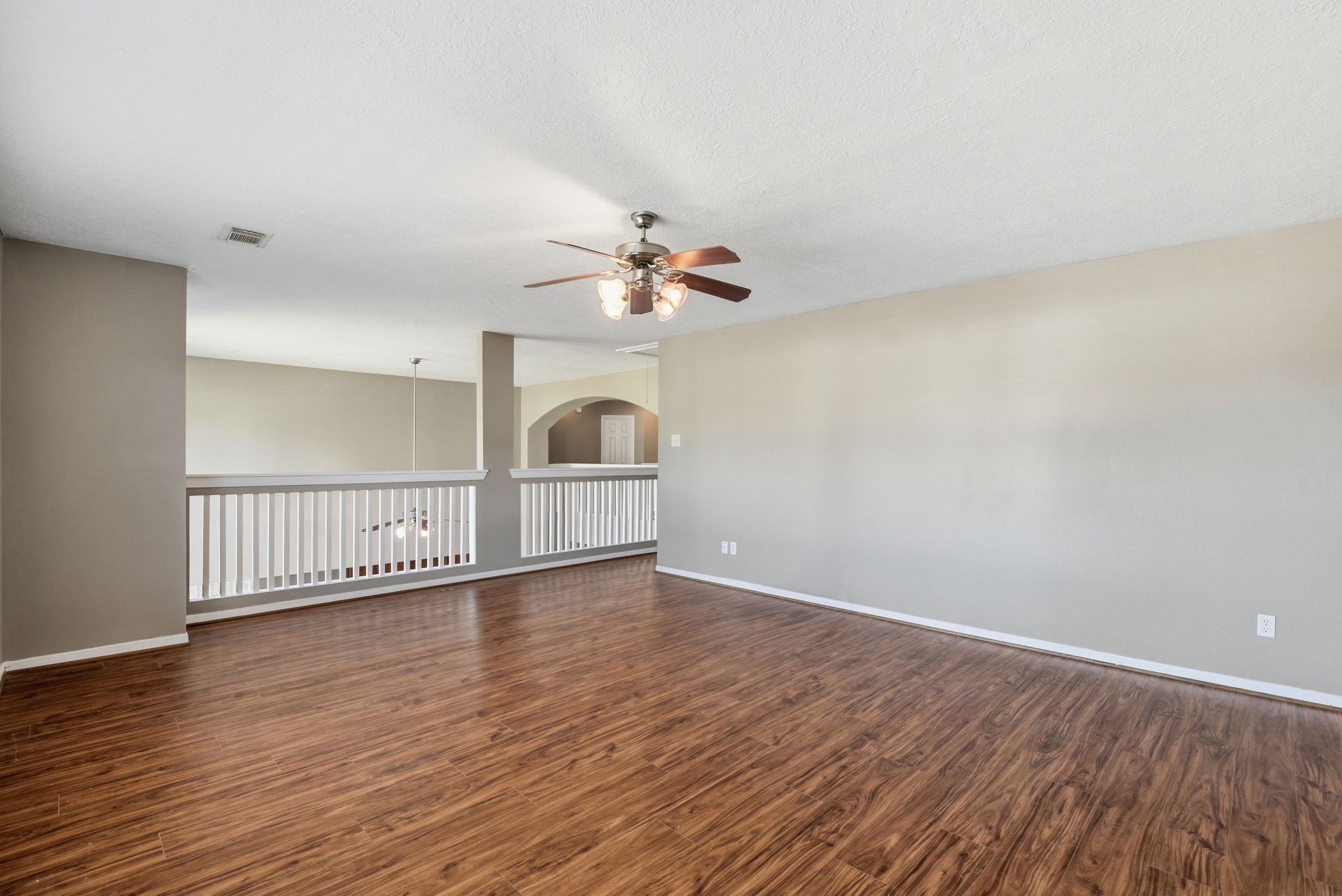 13902 Oneida Court Cypress, TX 77429 - Photo 34 of 48 an empty room with wooden floor fan and windows