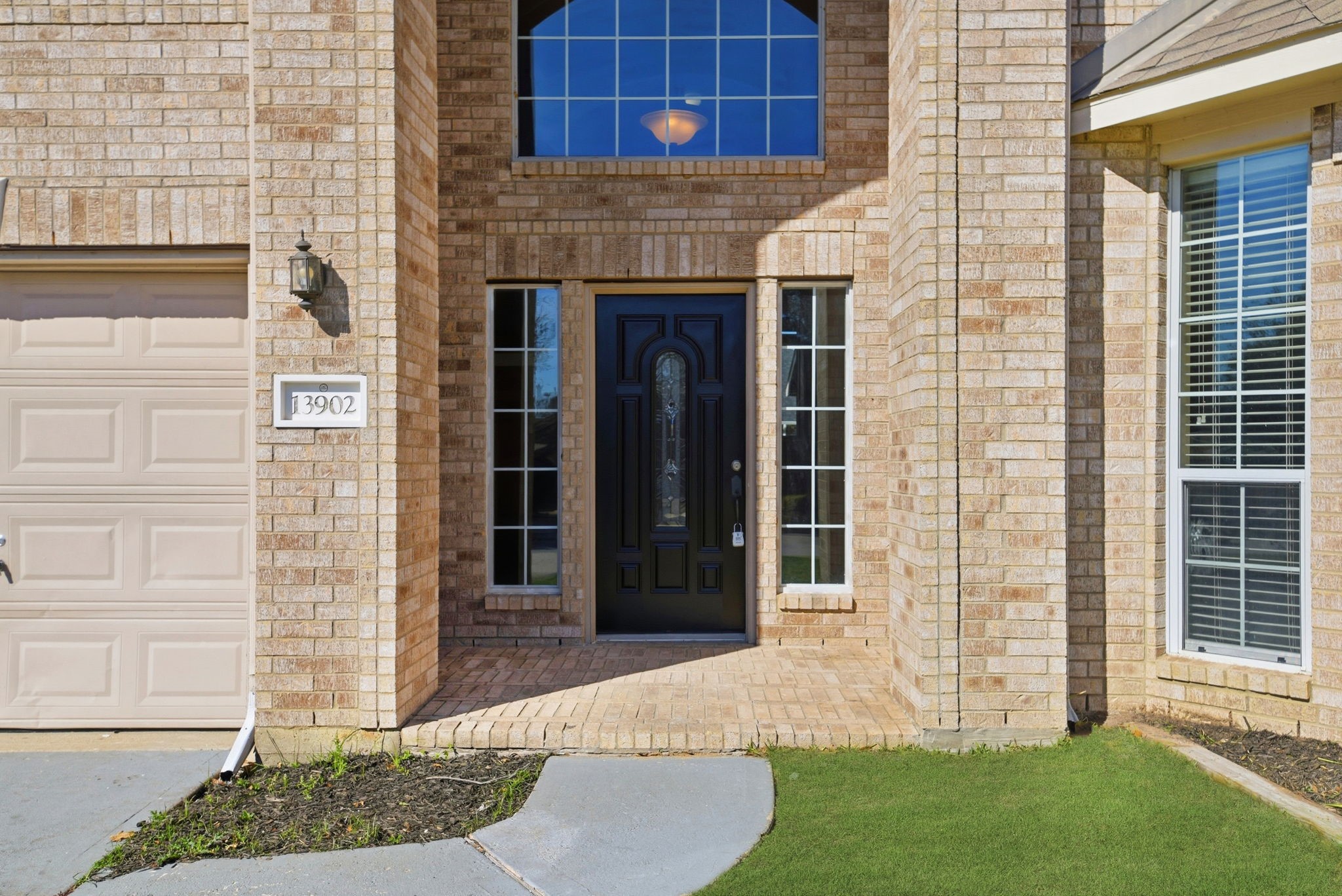 13902 Oneida Court Cypress, TX 77429 - Photo 4 of 48 a front view of a house with a garden