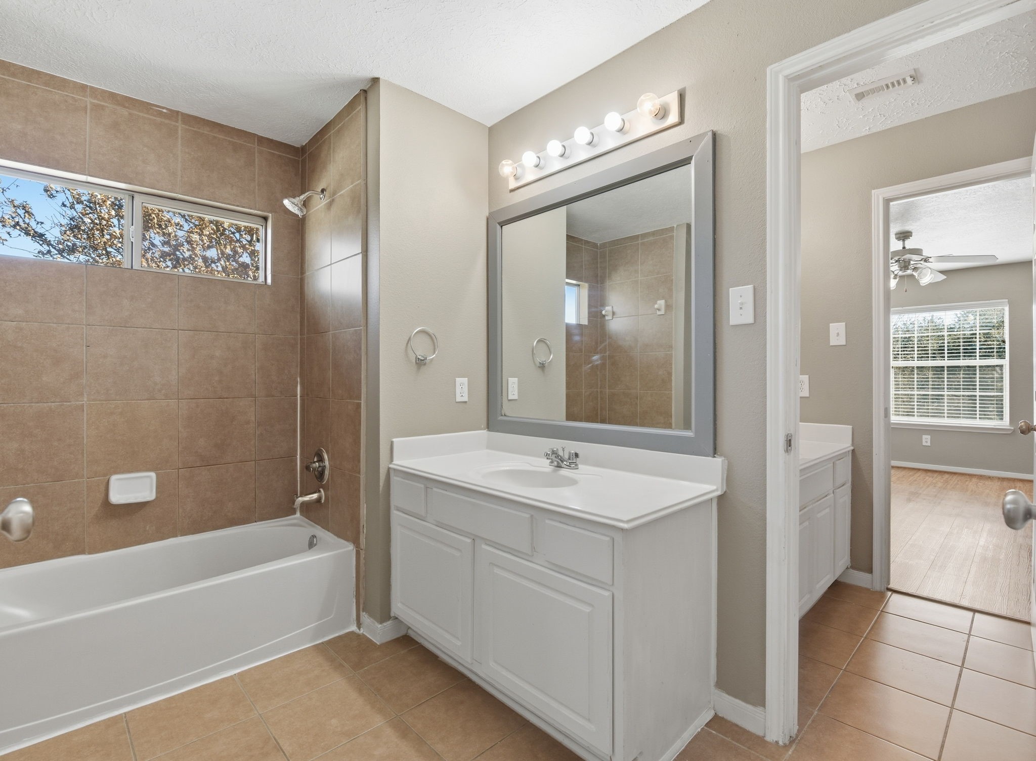 13902 Oneida Court Cypress, TX 77429 - Photo 42 of 48 a spacious bathroom with a tub sink shower and mirror