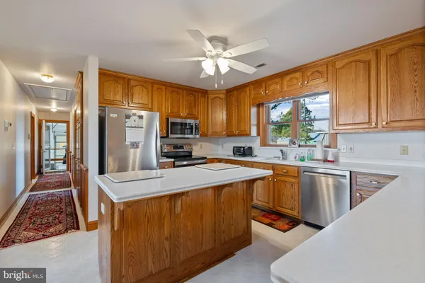 a kitchen with refrigerator cabinets and a sink