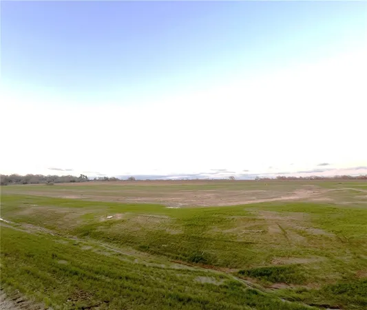 a view of a lake with a big yard