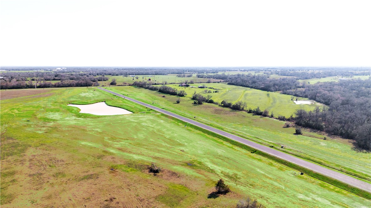 2425 Coronado Estates Drive Bryan, TX 77808 - Photo 29 of 44 an aerial view of a golf course with a lake view