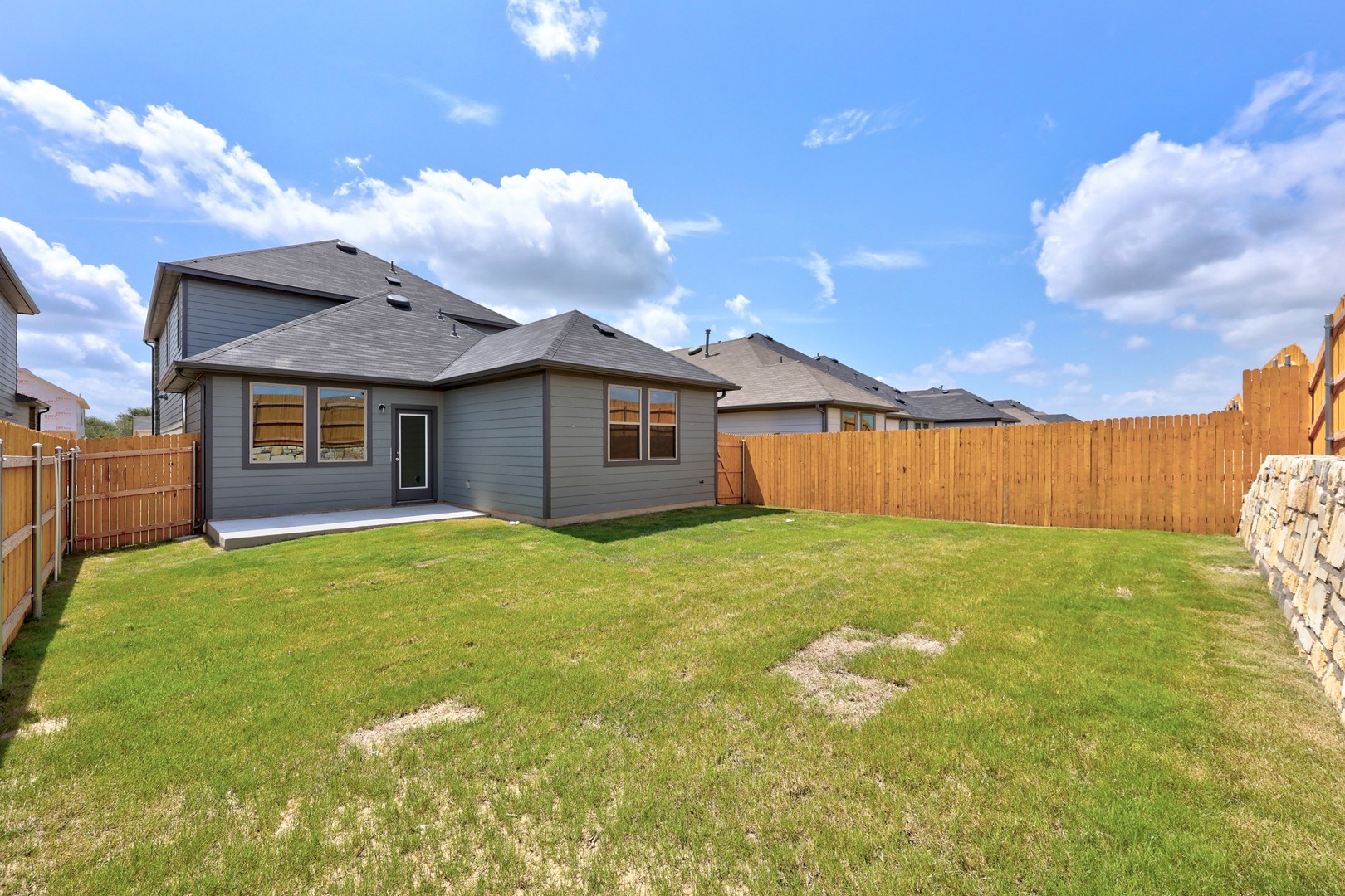 200 Hornet Street Elgin, TX 78621 - Photo 32 of 39 a view of a house with backyard and garden
