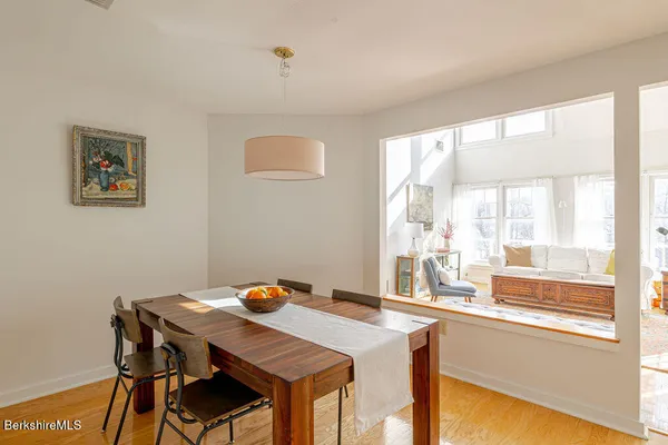 a dining room with a table and chairs