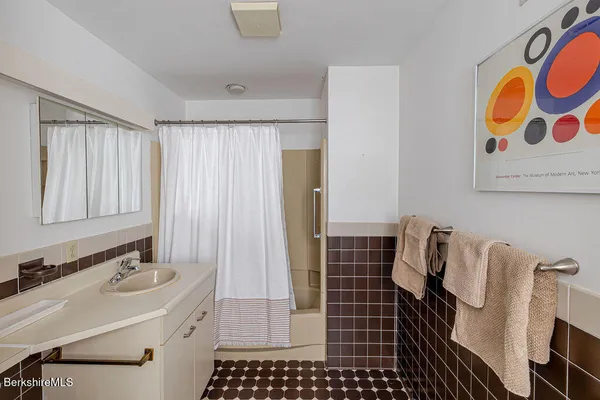 a view of a bench in wooden floor