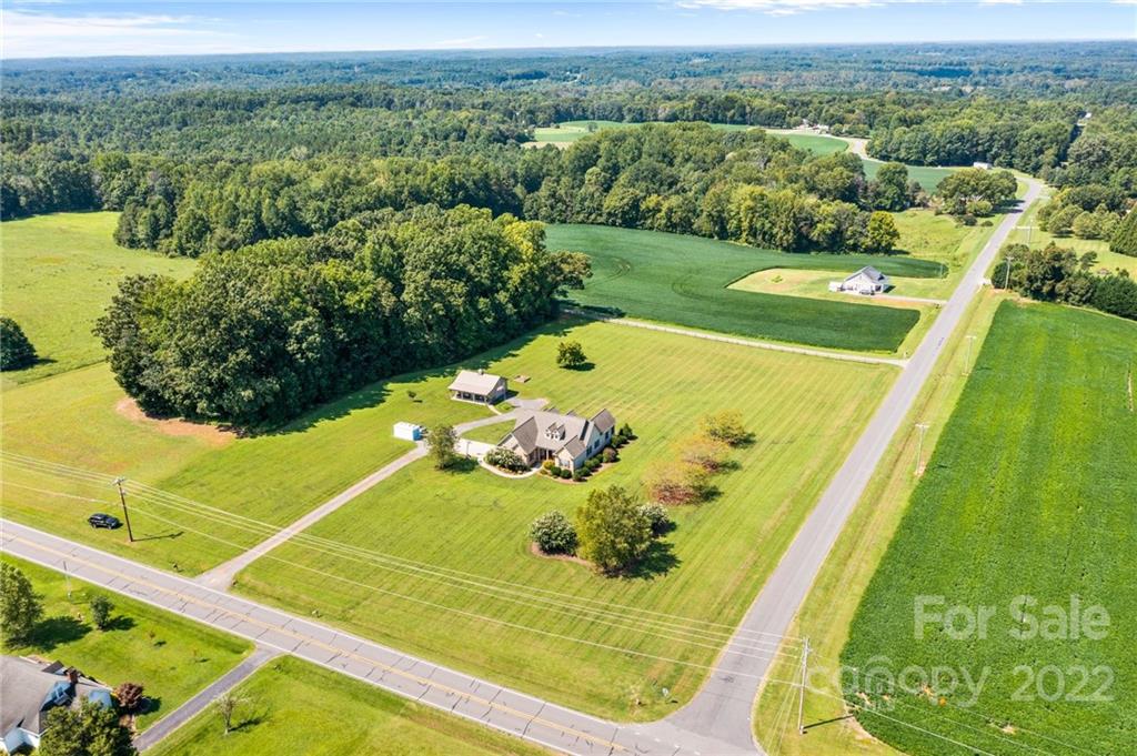 356 Greenhill Road Mocksville, NC 27028 - Photo 22 of 46 a view of a swimming pool with a garden and seating area