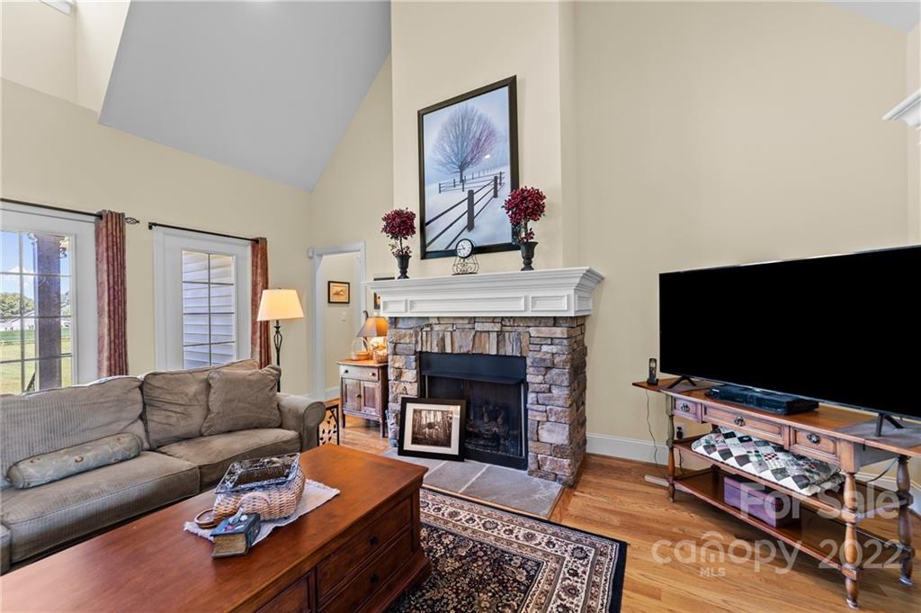 356 Greenhill Road Mocksville, NC 27028 - Photo 27 of 46 a living room with furniture a flat screen tv and a fireplace