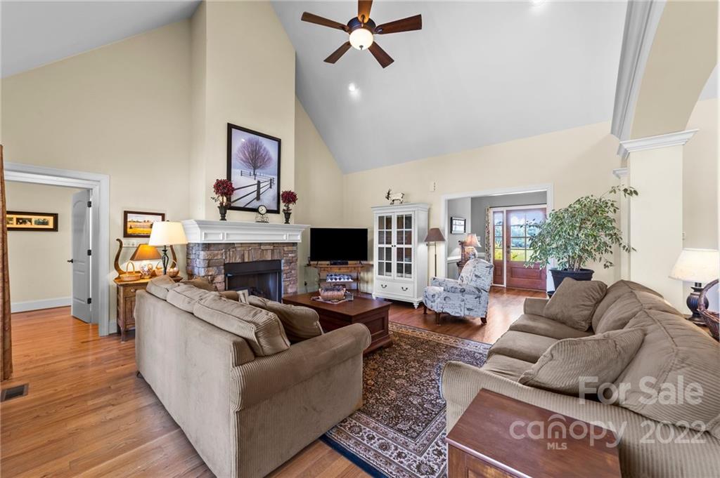 356 Greenhill Road Mocksville, NC 27028 - Photo 28 of 46 a living room with furniture a fireplace and a flat screen tv