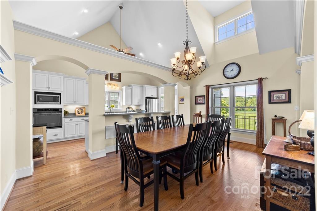 356 Greenhill Road Mocksville, NC 27028 - Photo 31 of 46 a view of a dining room with furniture window and wooden floor