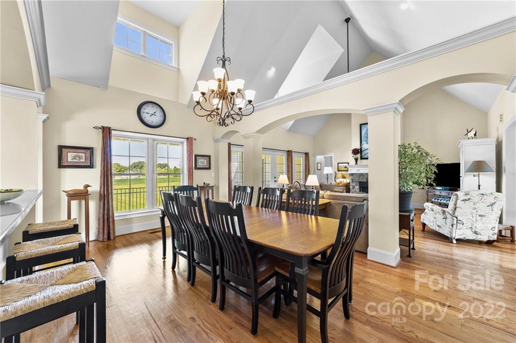 356 Greenhill Road Mocksville, NC 27028 - Photo 32 of 46 a view of a dining room with furniture a chandelier and wooden floor