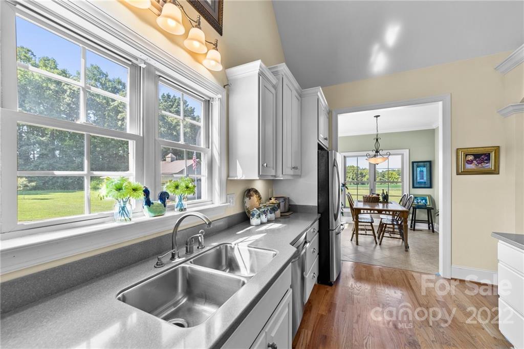356 Greenhill Road Mocksville, NC 27028 - Photo 37 of 46 a view of a kitchen with kitchen island granite countertop a large window in it