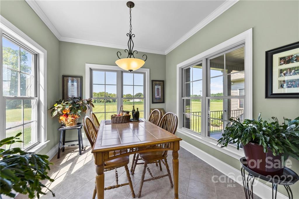 356 Greenhill Road Mocksville, NC 27028 - Photo 38 of 46 a view of a dining room with furniture window and wooden floor