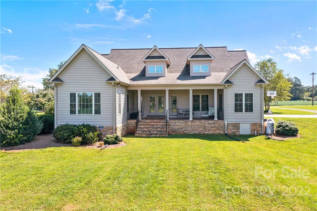 356 Greenhill Road Mocksville, NC 27028 - Photo 4 of 46 a view of a house with swimming pool next to a yard