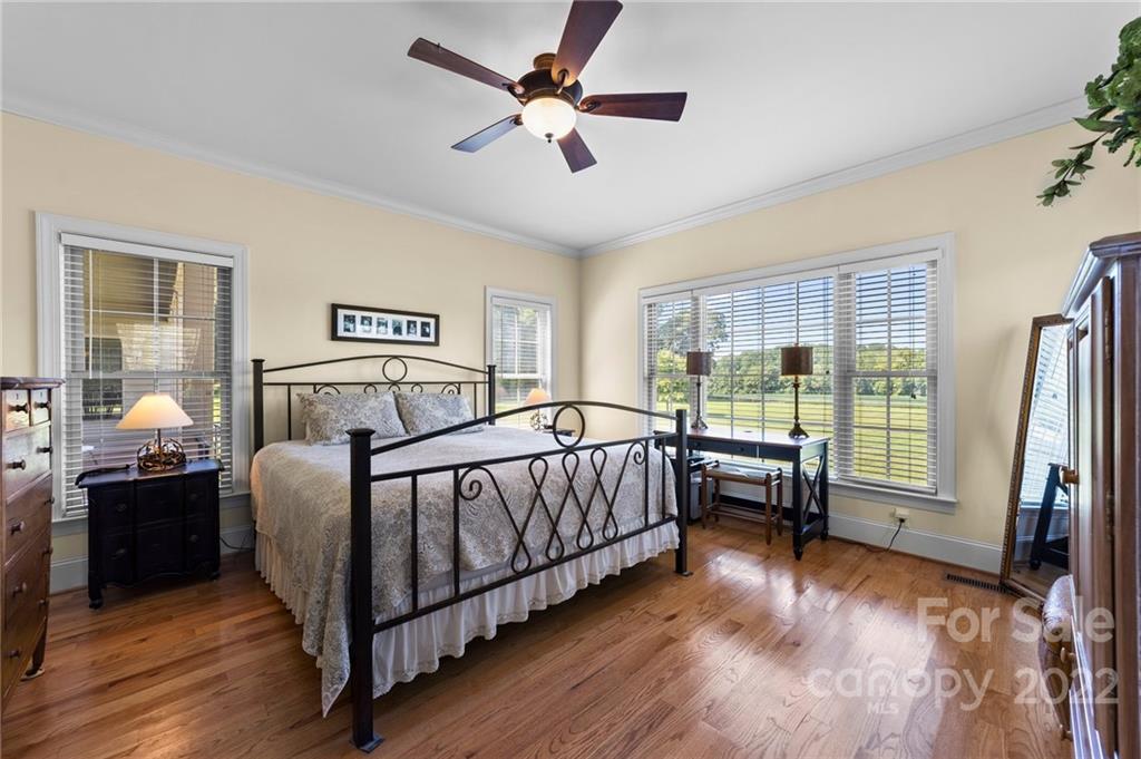 356 Greenhill Road Mocksville, NC 27028 - Photo 46 of 46 a bedroom with a bed and a chandelier