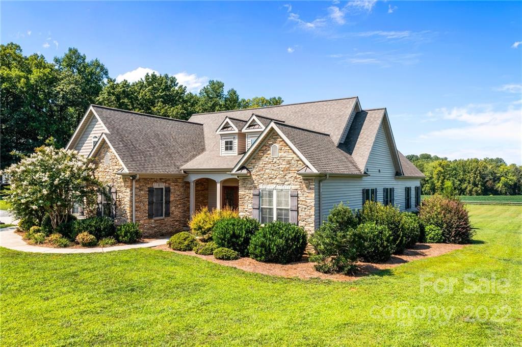 356 Greenhill Road Mocksville, NC 27028 - Photo 6 of 46 a view of a house with a yard and potted plants