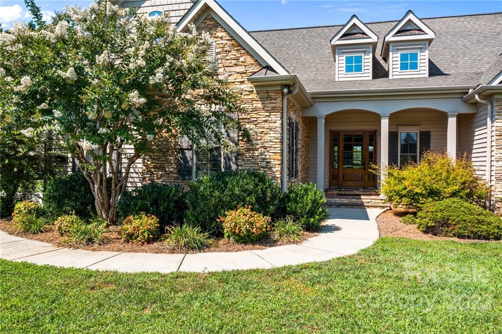 356 Greenhill Road Mocksville, NC 27028 - Photo 8 of 46 a front view of a house with a yard and potted plants