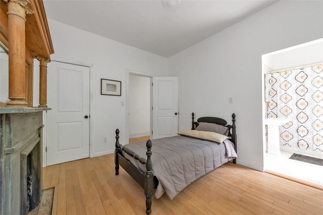 196 Decatur Street Brooklyn, NY 11233 - Photo 11 of 20 a bedroom with a bed and a window