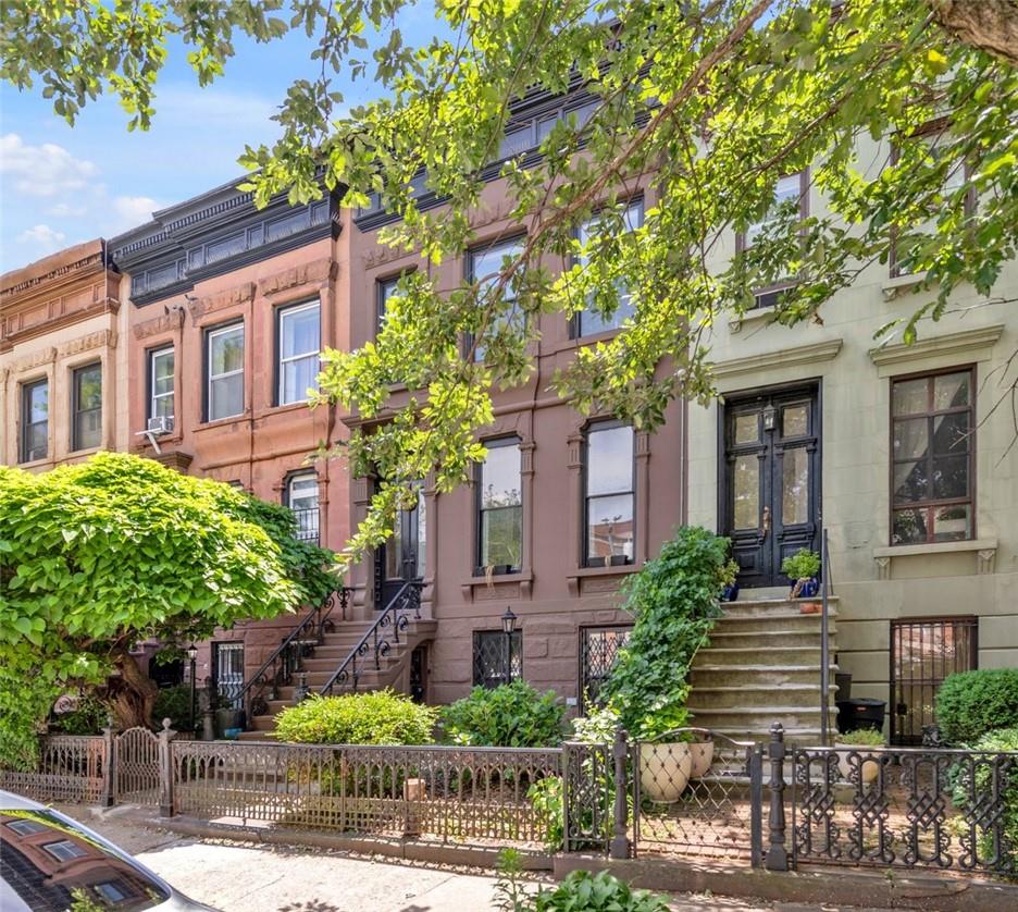 196 Decatur Street Brooklyn, NY 11233 - Photo 19 of 20 a front view of a house with garden