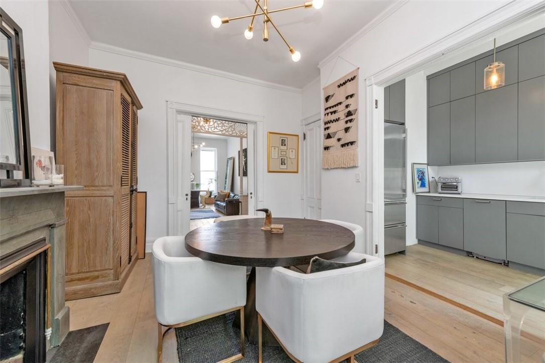 196 Decatur Street Brooklyn, NY 11233 - Photo 3 of 20 a kitchen with stainless steel appliances a table and chairs