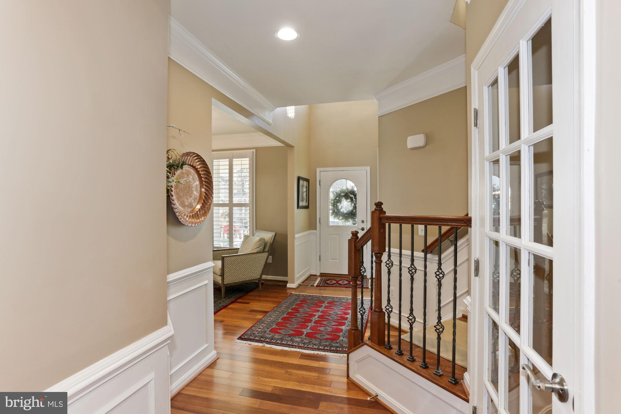 23372 Minerva Drive Brambleton, VA 20148 - Photo 38 of 52 Main floor hallway, doorway to lower level
