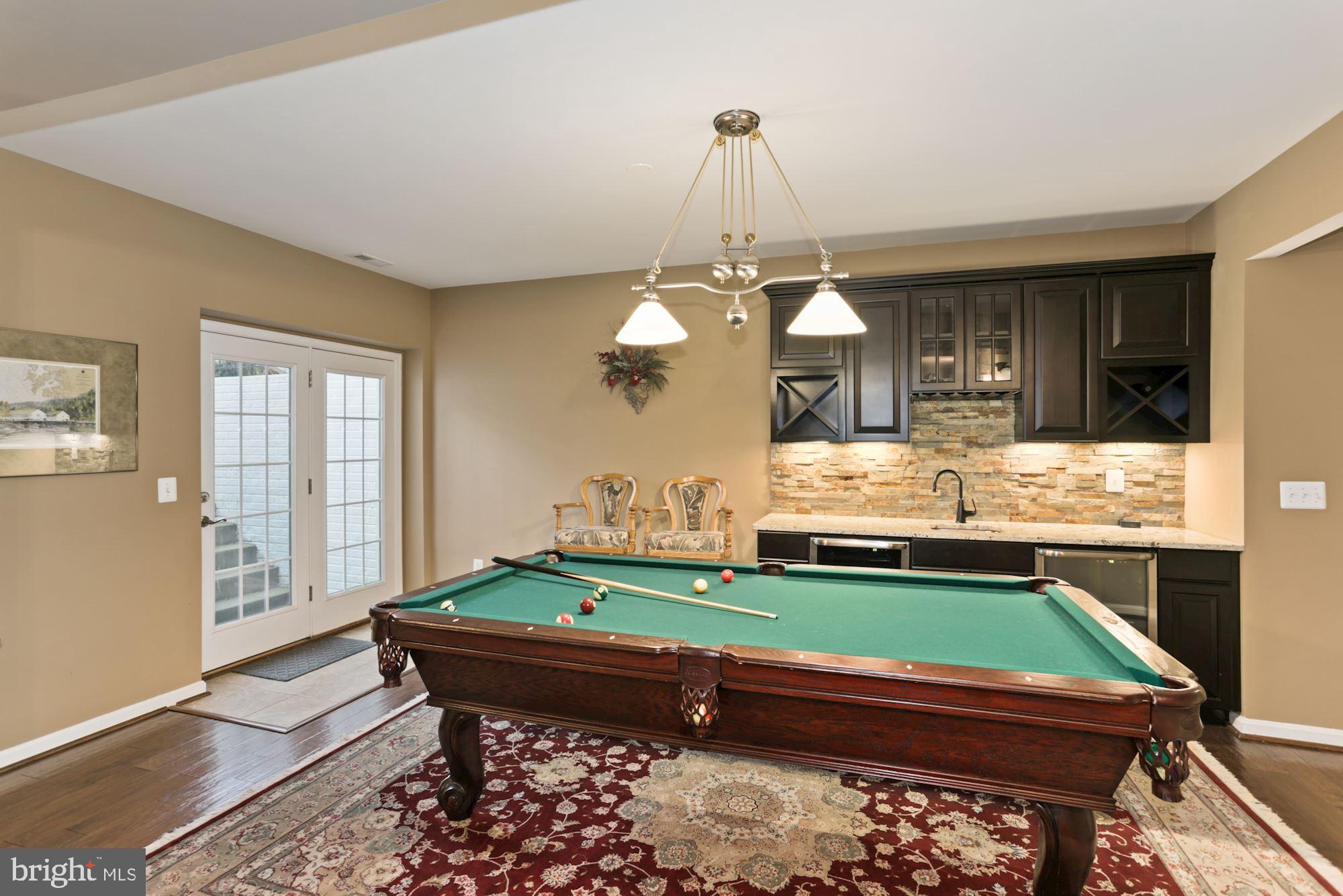 23372 Minerva Drive Brambleton, VA 20148 - Photo 40 of 52 Recreation Room, Walk Up to back yard