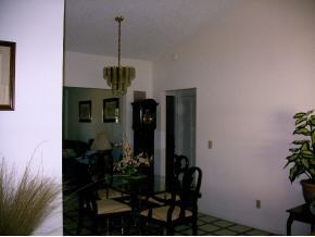 1318 Northeast Riviera Palm Bay, FL 32905 - Photo 6 of 12 a dining room with furniture and potted plants