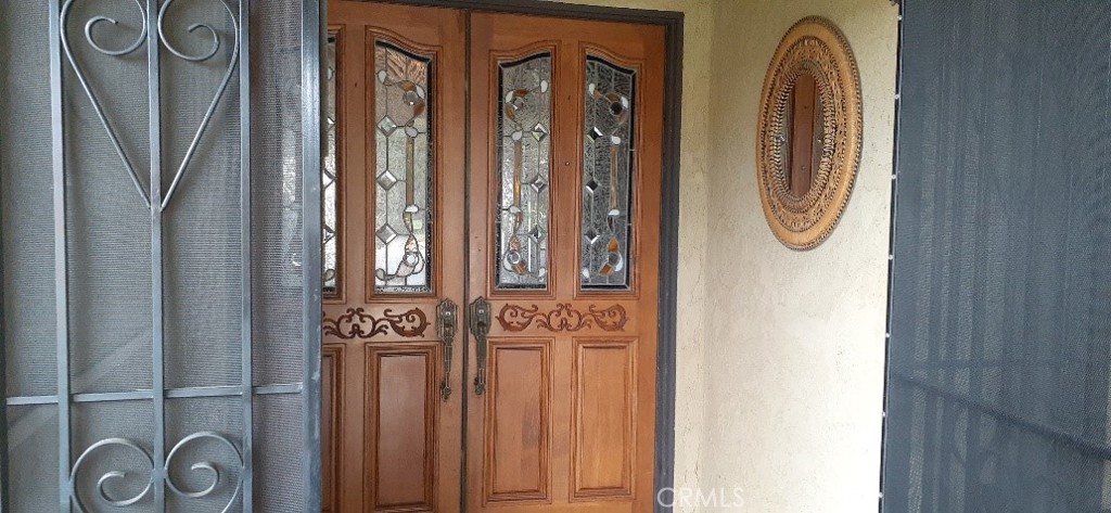 1484 Pepper Tree Drive Hemet, CA 92545 - Photo 9 of 29 Solid Double Doors with stain glass inserts