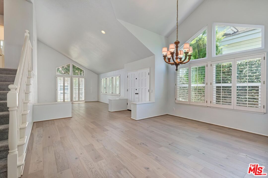 7557 West 82nd Street Playa del Rey, CA 90293 - Photo 12 of 35 a view of an empty room with wooden floor and a window