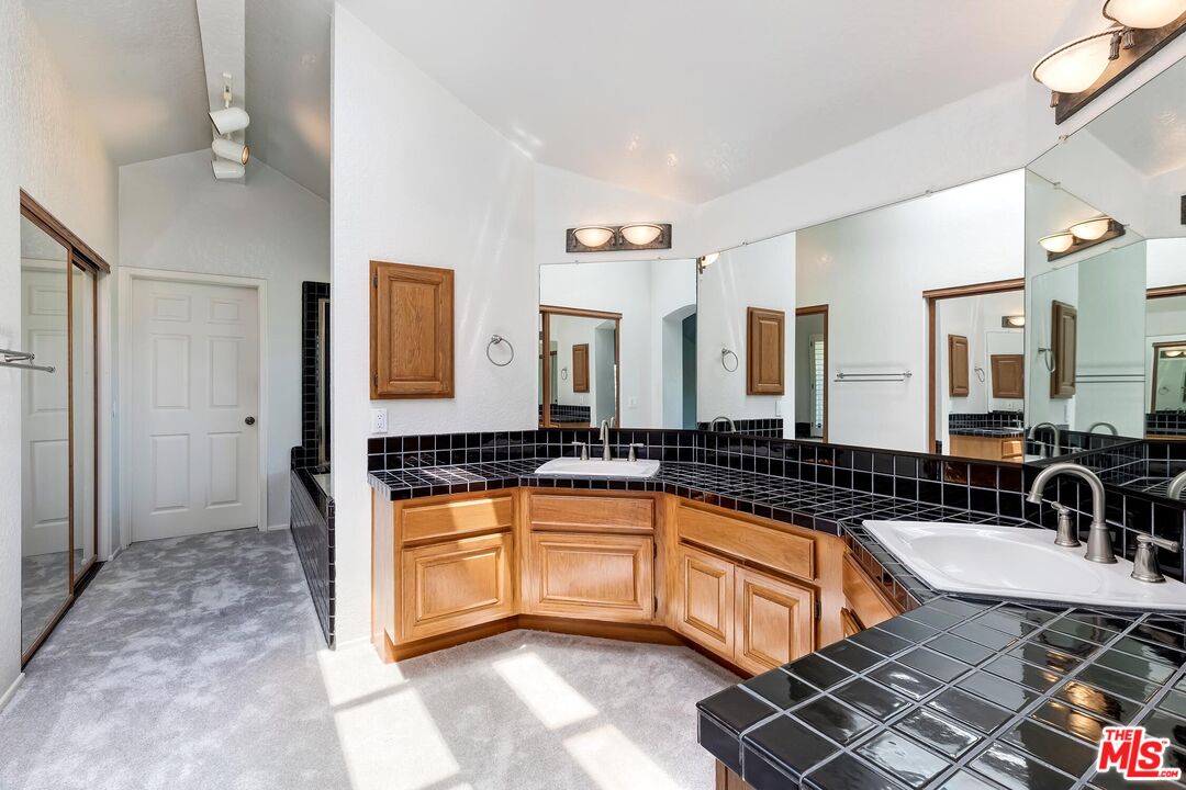 7557 West 82nd Street Playa del Rey, CA 90293 - Photo 25 of 35 a large kitchen with granite countertop a sink and a counter top space