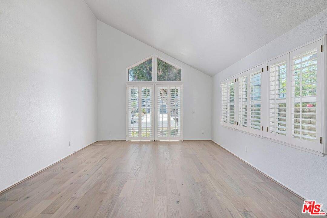 7557 West 82nd Street Playa del Rey, CA 90293 - Photo 7 of 35 wooden floor in an empty room with a window