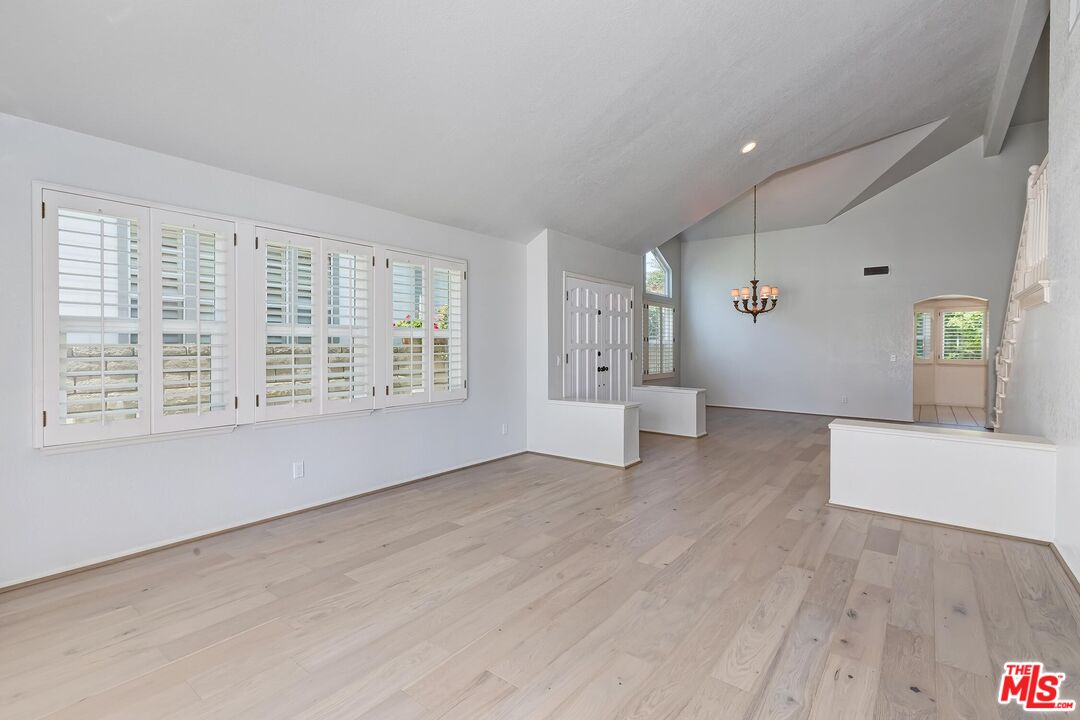 7557 West 82nd Street Playa del Rey, CA 90293 - Photo 9 of 35 wooden floor in an empty room with a window