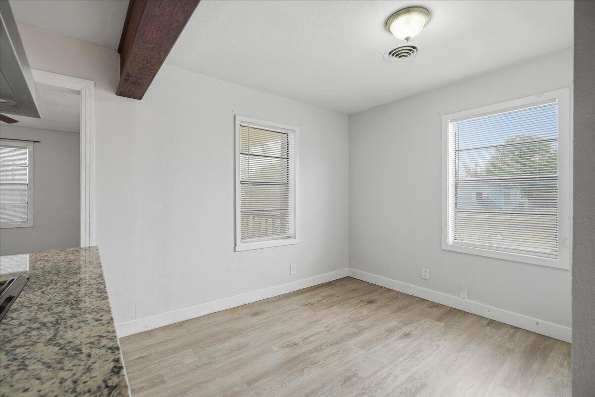 2503 30th Street Lubbock, TX 79410 - Photo 11 of 26 an empty room with a window