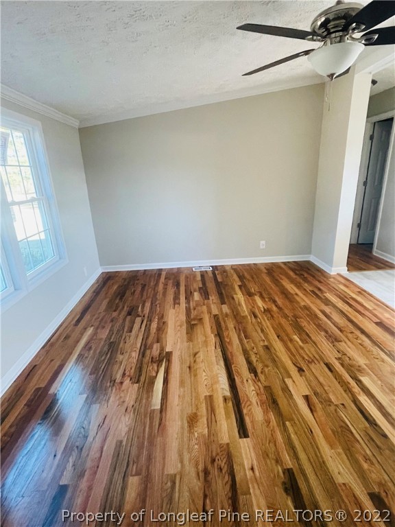 7050 Faircloth Bridge Road Stedman, NC 28391 - Photo 2 of 21 a view of a room with wooden floor