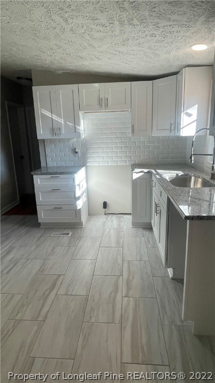 7050 Faircloth Bridge Road Stedman, NC 28391 - Photo 5 of 21 a view of kitchen with cabinets and window