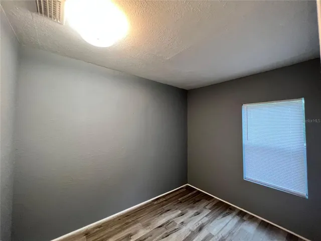 a kitchen with stainless steel appliances a refrigerator sink and microwave