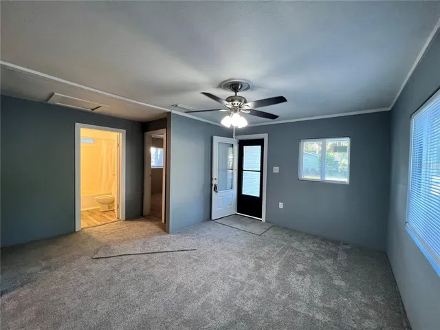 a view of an empty room with a window