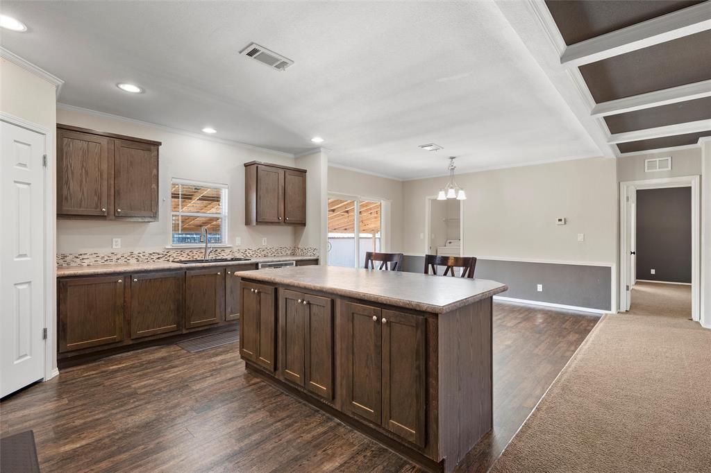 1605 Cloverleaf Road Bellmead, TX 76705 - Photo 13 of 29 a kitchen with stainless steel appliances granite countertop a sink stove and cabinets