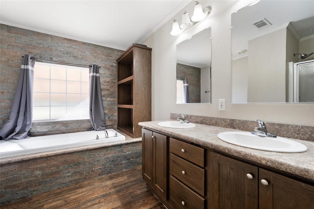 1605 Cloverleaf Road Bellmead, TX 76705 - Photo 17 of 29 a bathroom with a granite countertop sink mirror and double