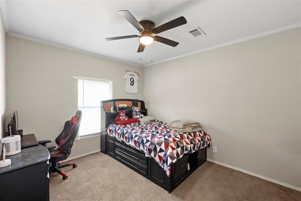 1605 Cloverleaf Road Bellmead, TX 76705 - Photo 22 of 29 a bedroom with a bed and a window