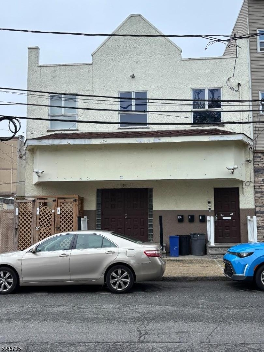 a front view of a house with parking space