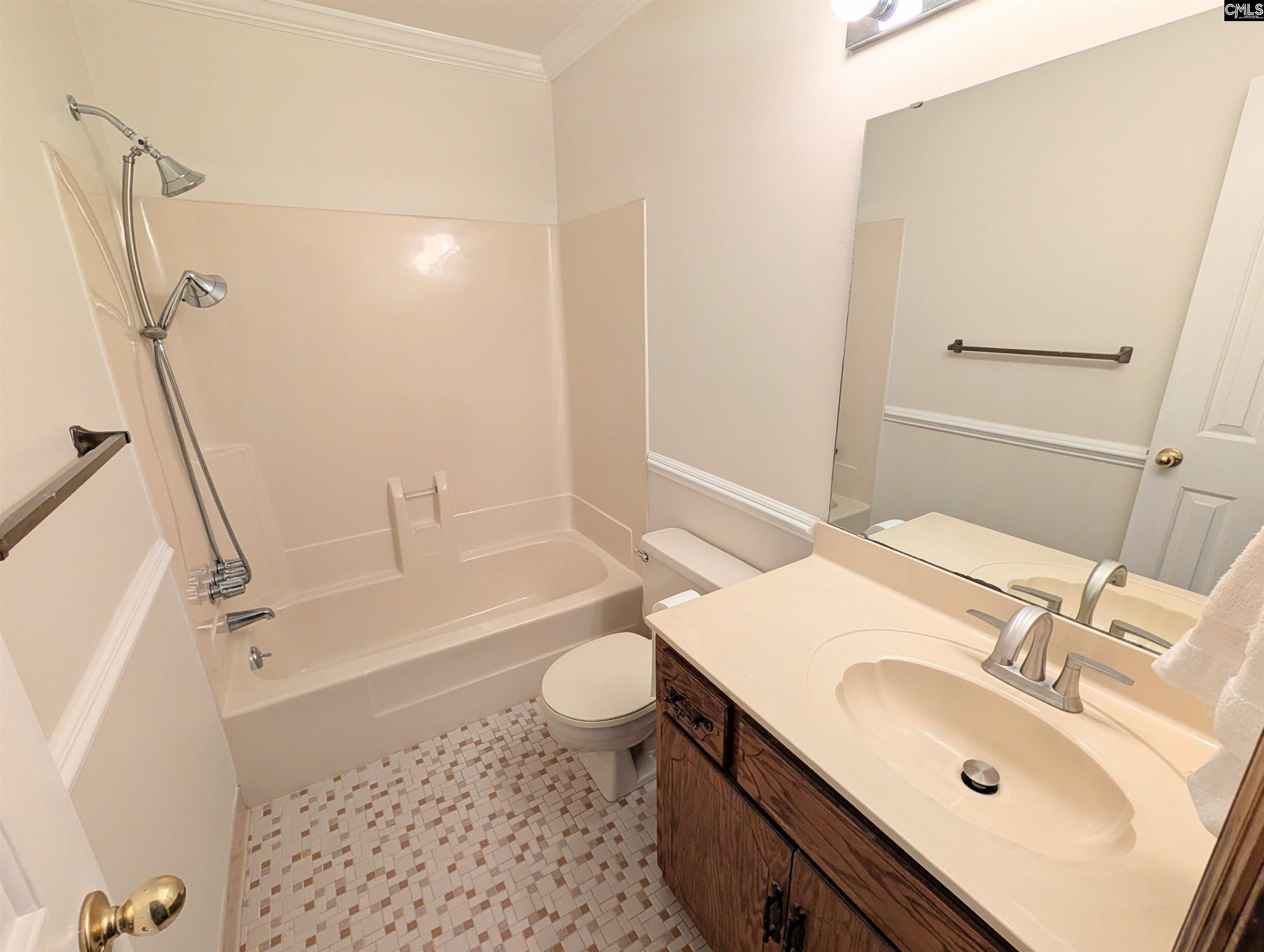 100 Welsh Court Lexington, SC 29073 - Photo 14 of 27 a bathroom with a sink a toilet and a bathtub