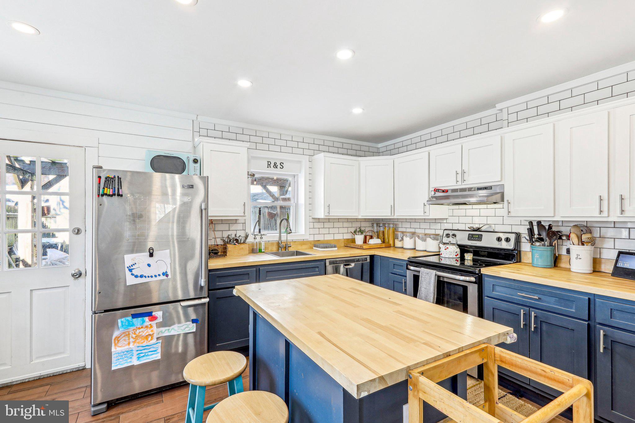 456 Ripka Street Philadelphia, PA 19128 - Photo 9 of 29 a kitchen with stainless steel appliances granite countertop a sink stove and refrigerator