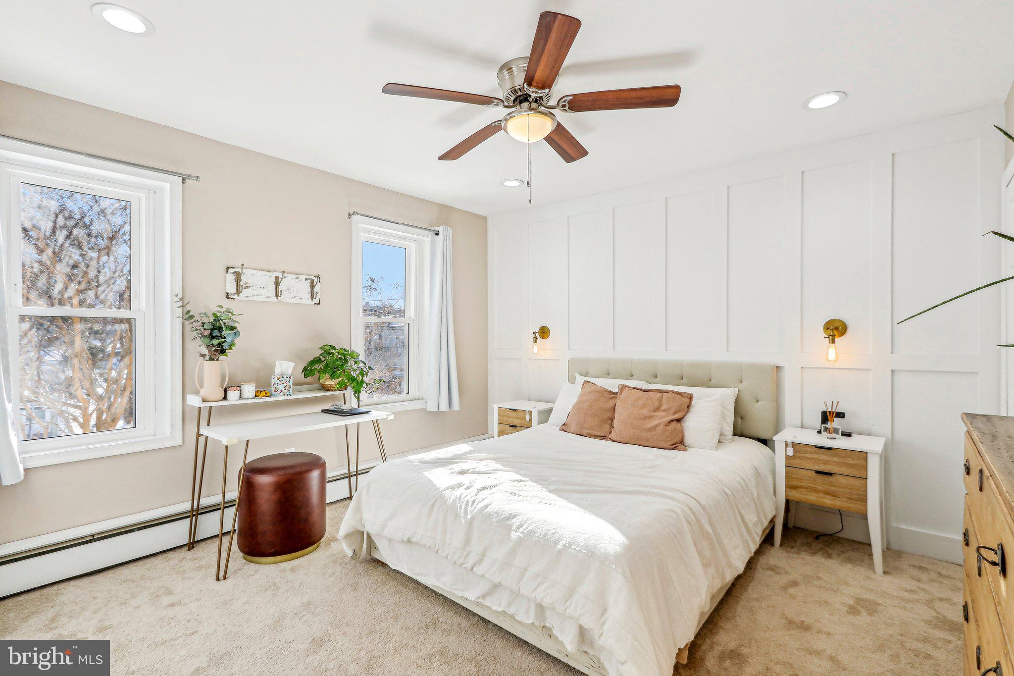 456 Ripka Street Philadelphia, PA 19128 - Photo 10 of 29 a bedroom with a large bed and a chandelier