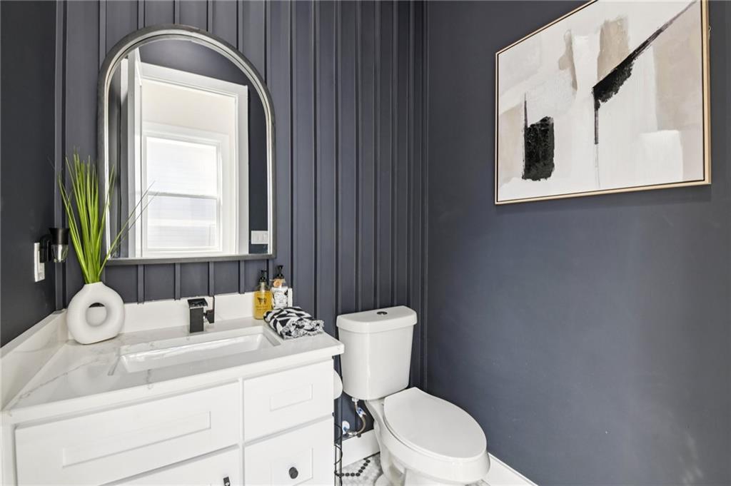 2014 Cambridge Avenue Atlanta, GA 30337 - Photo 12 of 34 a bathroom with a toilet a sink and mirror