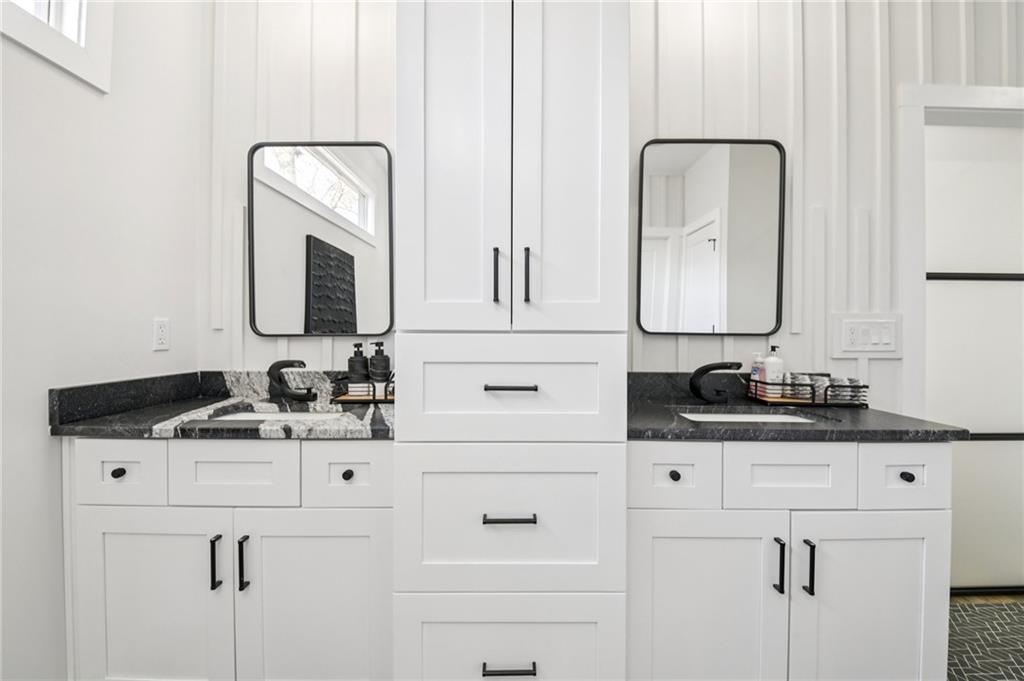 2014 Cambridge Avenue Atlanta, GA 30337 - Photo 18 of 34 a bathroom with cabinets sink and a mirror