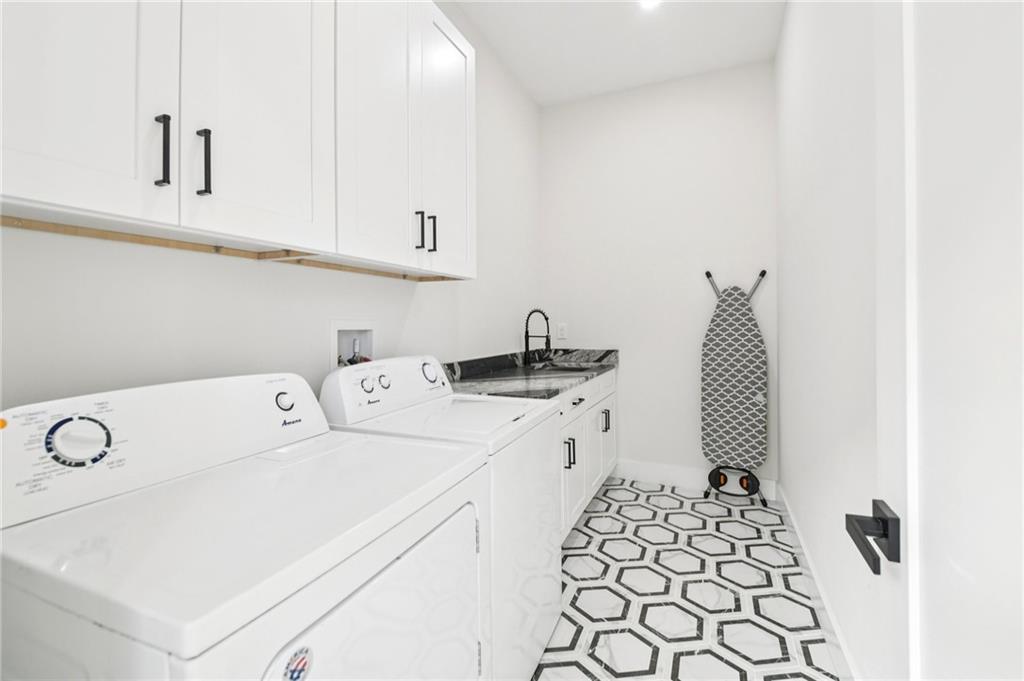 2014 Cambridge Avenue Atlanta, GA 30337 - Photo 23 of 34 a utility room with dryer and washer