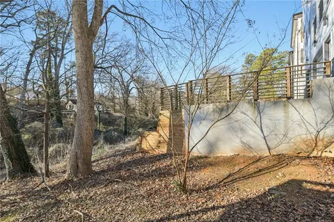 a balcony with furniture and wooden floor